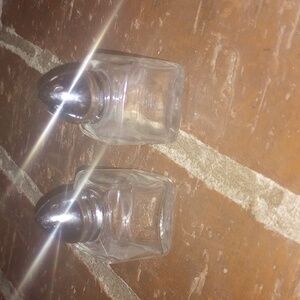 Glass Salt and Pepper Shakers with Silver Tops